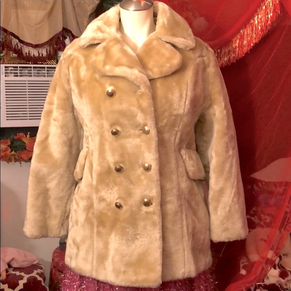 Short faux fur coat.